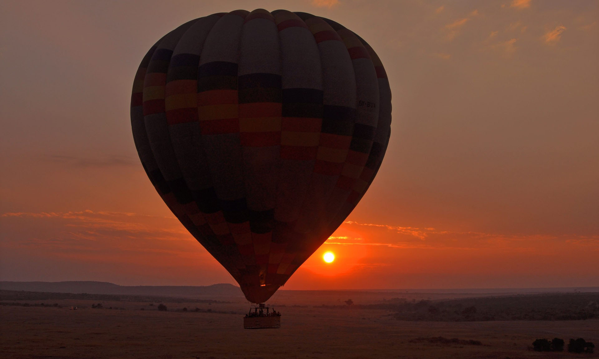 hot air balloon in the air at sunset